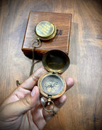 Engraving on the backside of an antique brass compass, perfect for names, dates, or special messages.