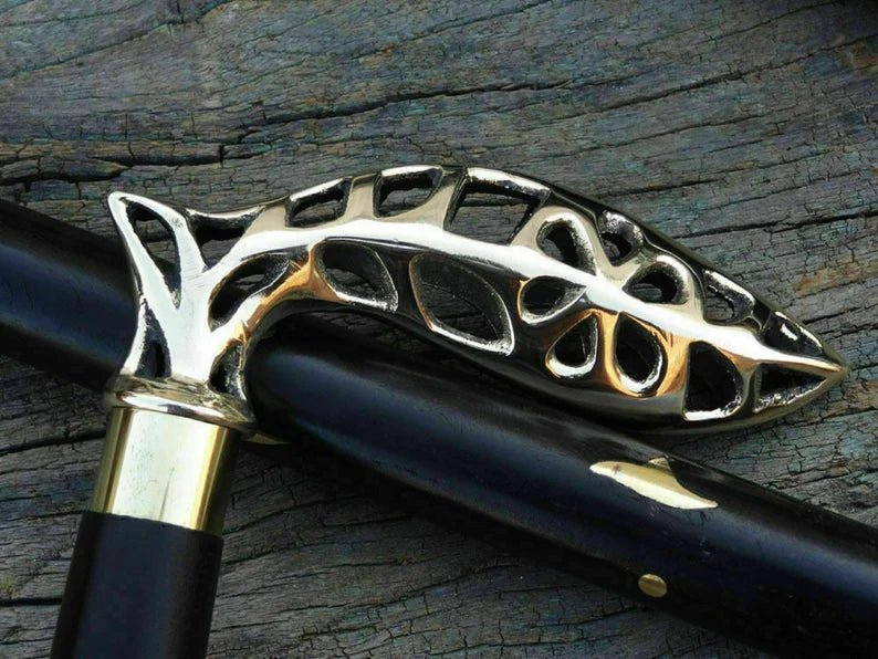 Nautical Cane Wooden Walking Stick displayed as a decorative piece on a table, adding vintage charm to the setting.