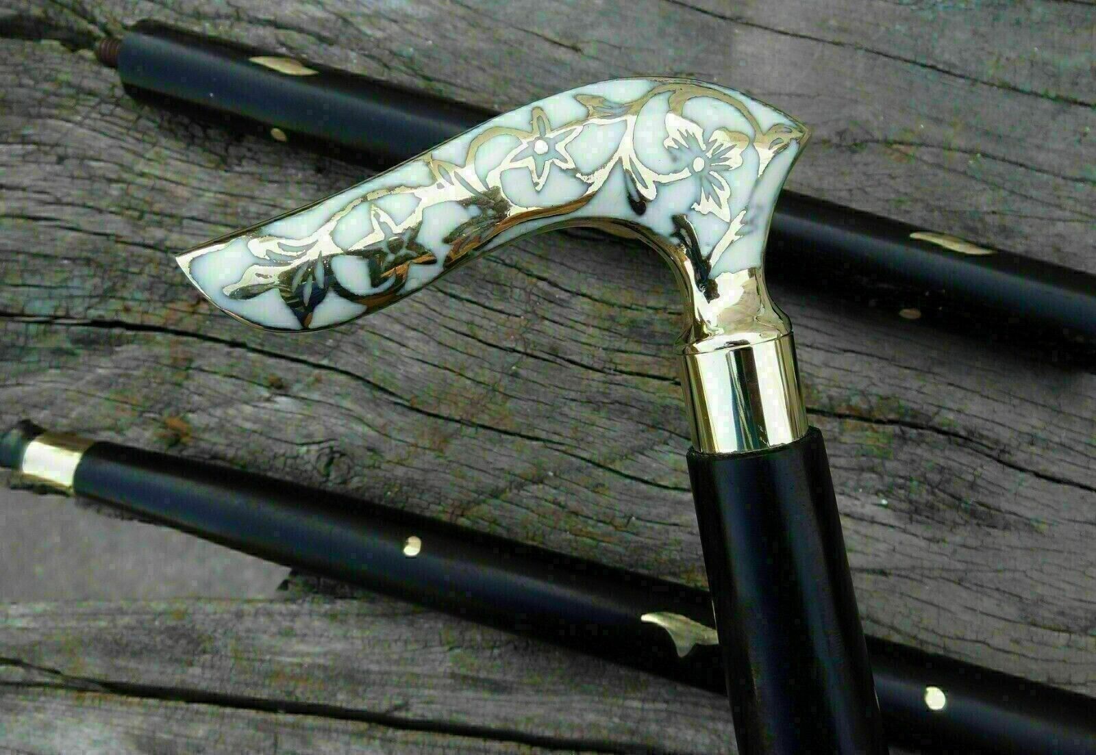 Close-up view of the antique Victorian designer walking stick cane with a polished, smooth finish.