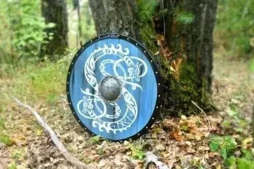 Blue Medieval Viking shield used as a Halloween prop, ideal for costume parties and medieval-themed events