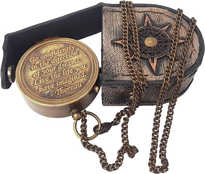 Brass compass engraved with Thoreau's "Go Confidently" quote, complete with stamped leather case.