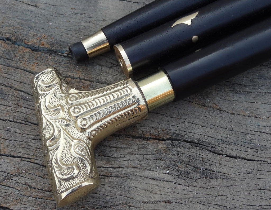 Close-up view of the brass handle with an 11cm length on the vintage-style wooden walking stick.