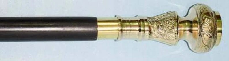 Close-up of the sleek finish of the brass handle and wooden stick, perfect for daily tasks.