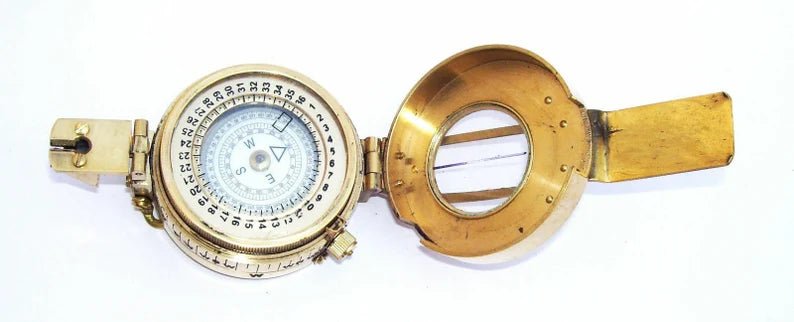 Close-up detail of handmade brass and glass Maritime Pocket Compass with vintage design.