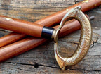 Brass ring design head handle on a nautical brown wooden walking stick cane, showcasing fine craftsmanship.