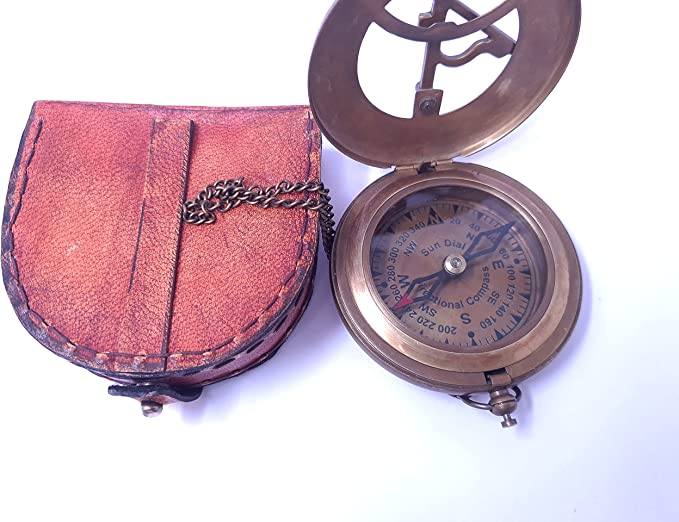 Close-up of brass sundial compass with intricate details and antique finish, perfect for collectors.