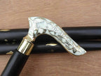Close-up of Antique Brass Nautical Walking Cane with Detailed Brass Handle
