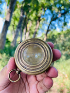 Nautical compass with a protective leather case, perfect for gifting