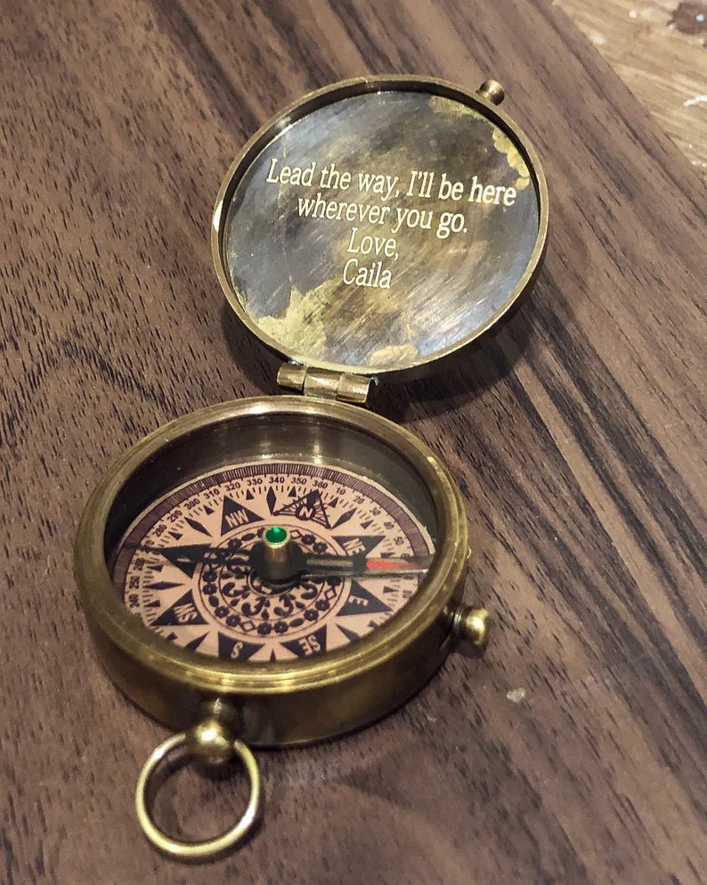 Close-up of custom engraving on the inside lid of the nautical compass.