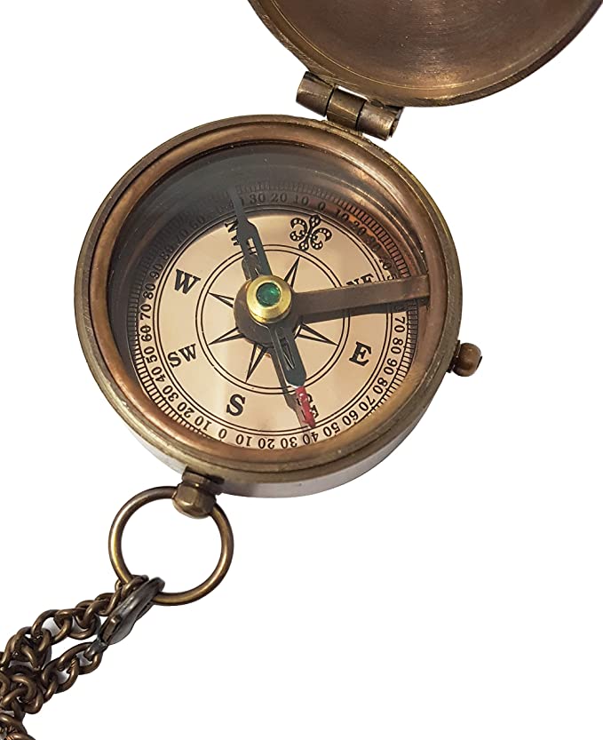 Detailed view of the handcrafted brass compass, showcasing its vintage design and the engraved Joshua 1:9 scripture.
