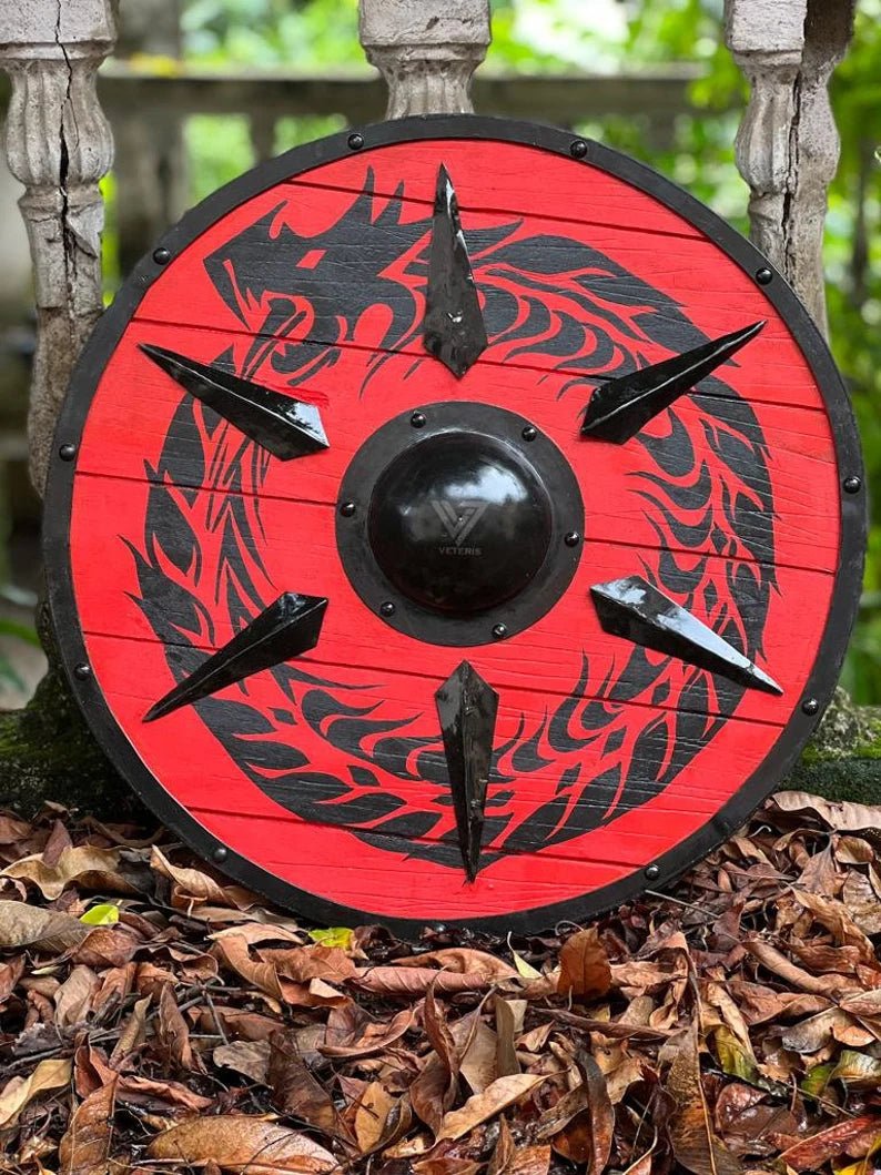 Handcrafted 24-inch Viking shield made of wood, perfect for medieval reenactments and display. Battle-ready craftsmanship for collectors.