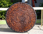 Handcrafted Viking wooden shield, perfect for medieval display and historical reenactments