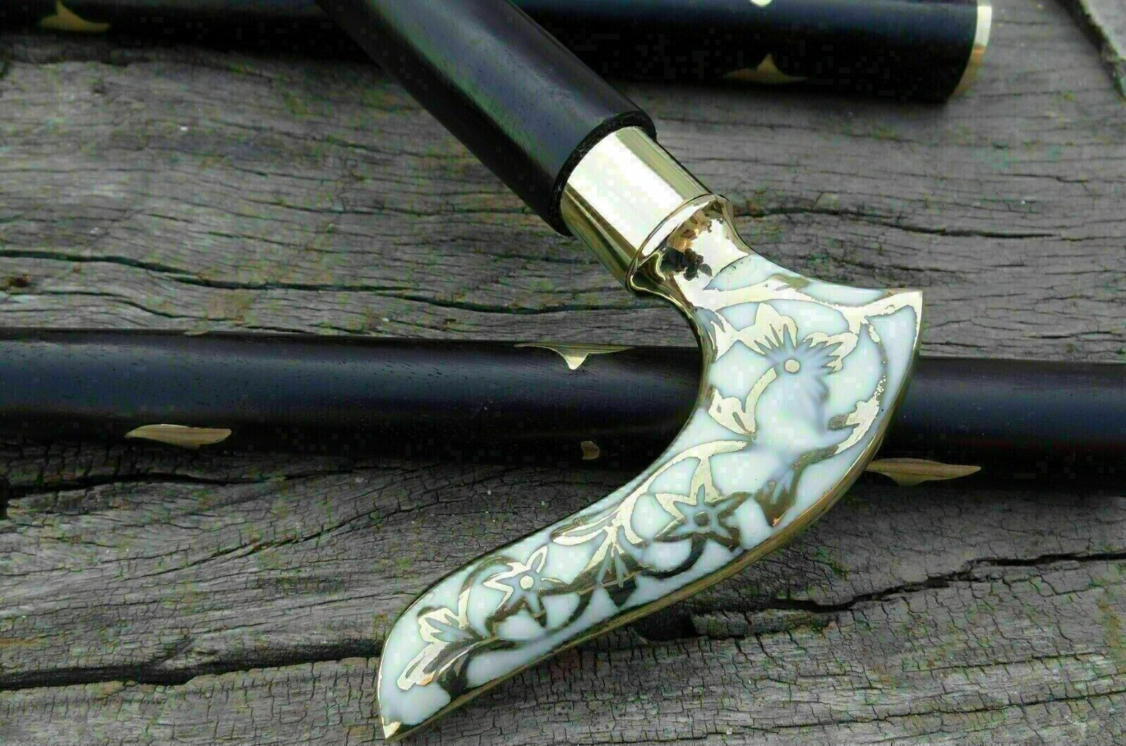 Handmade brass handle walking stick cane with intricate detailing, showcasing expert craftsmanship.