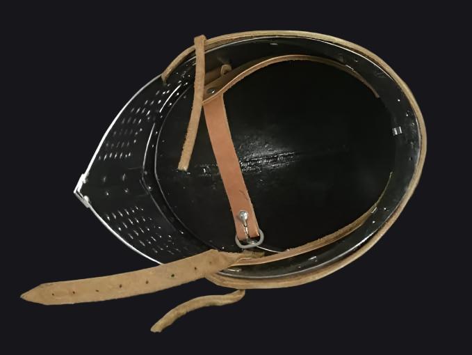 Side view of a traditional Bascinet helmet, crafted for durability and knightly protection.