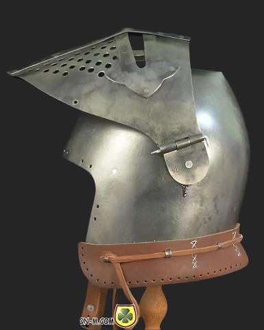 A person wearing a medieval Bascinet helmet, showcasing its comfortable fit and authentic appearance.