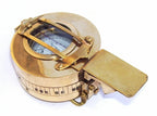 Person holding a Maritime Polished Brass Nautical British Prismatic Military Pocket Compass, showcasing its compact size and functionality.