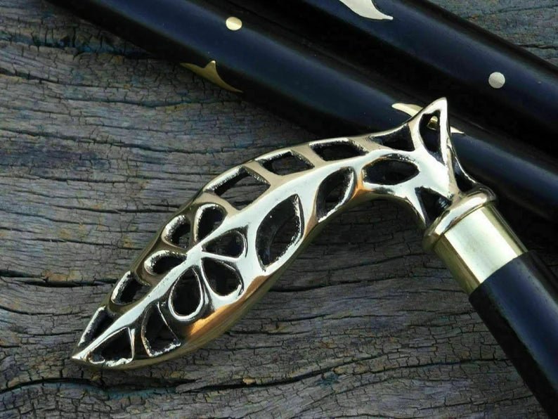 Dismantled sections of the Nautical Cane Wooden Walking Stick, highlighting its removable wooden shaft and brass ring.