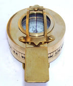 Maritime Prismatic Pocket Compass with visible size dimensions (2.5 x 4 x 1.3 inches) next to a ruler for scale