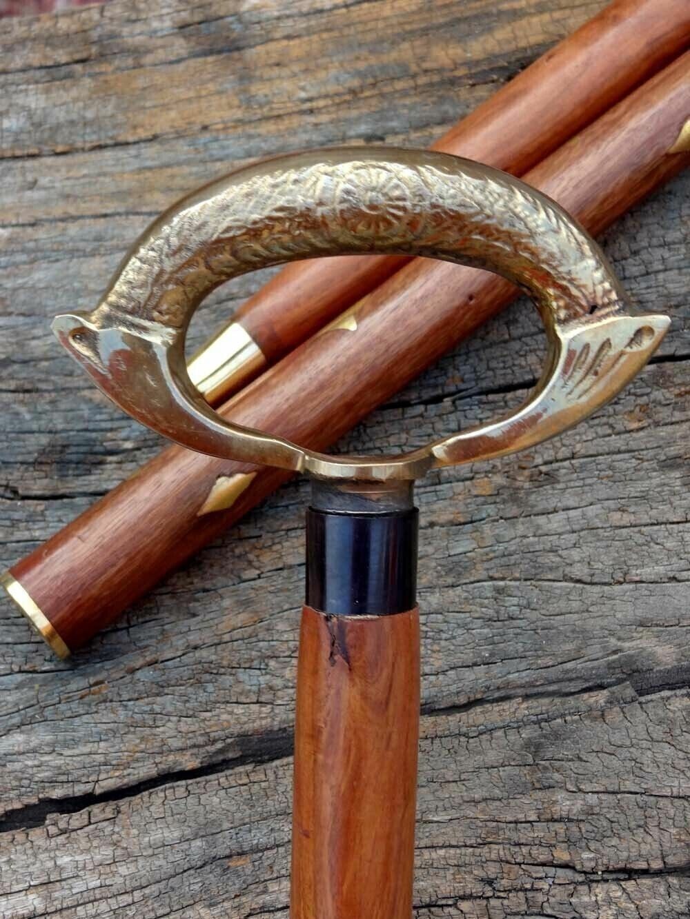 Removable brass ring between the handle and shaft of a vintage nautical walking stick cane.