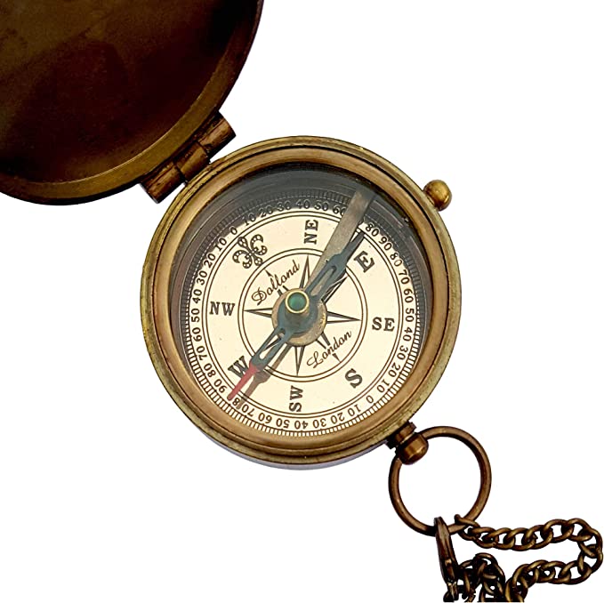 Close-up of the engraved "Go Confidently" quote on Thoreau's brass compass, a thoughtful gift for special occasions.