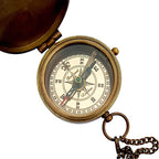 Close-up of the engraved "Go Confidently" quote on Thoreau's brass compass, a thoughtful gift for special occasions.