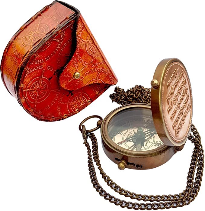 Close-up of Thoreau's quote "Go Confidently in the Direction of Your Dreams" engraved on the brass compass.