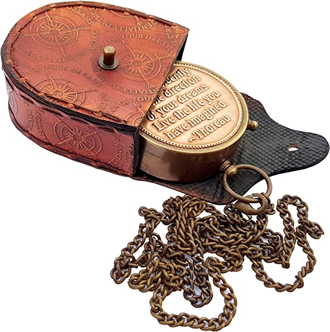 Side view of Thoreau's "Go Confidently" brass compass, featuring detailed engraving and classic design.