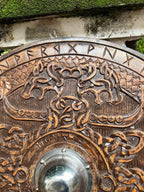 Close-up of the central iron boss on the Viking Round Dragon Shield, emphasizing the shield's durability.
