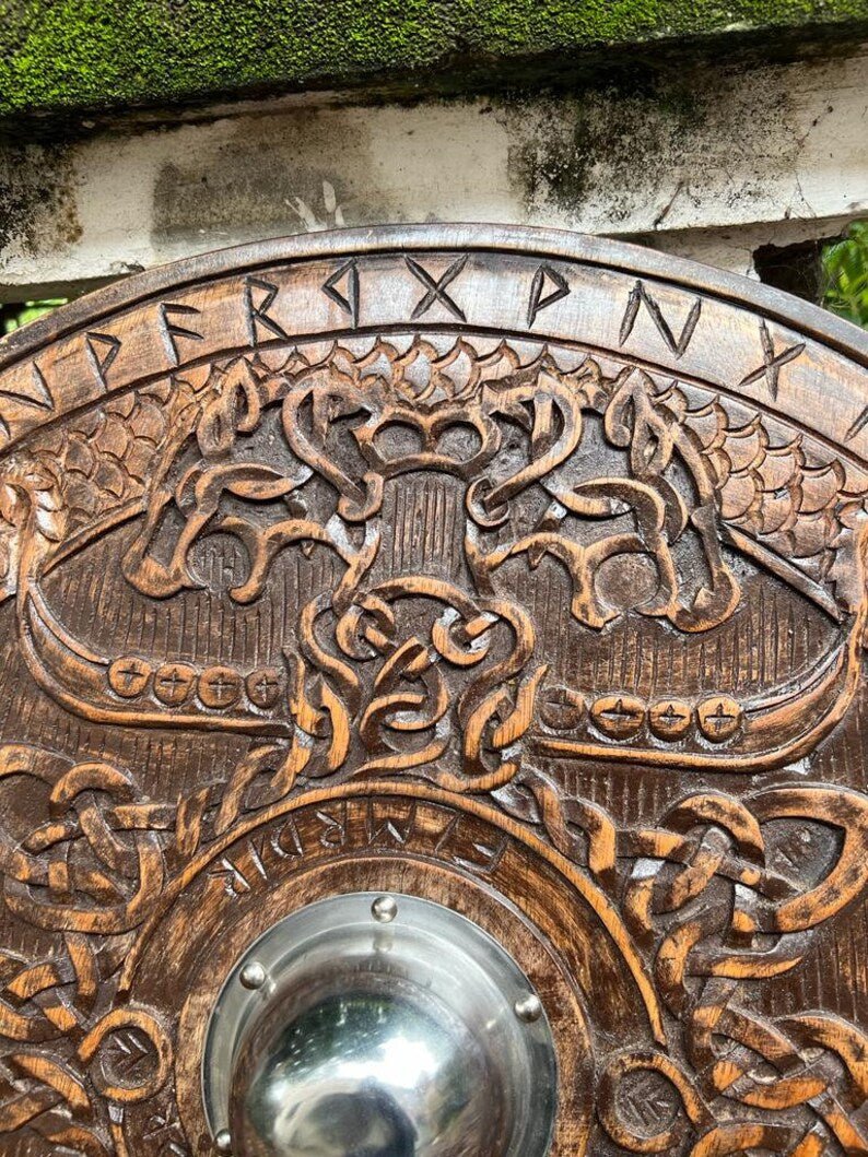 Close-up of the central iron boss on the Viking Round Dragon Shield, emphasizing the shield's durability.