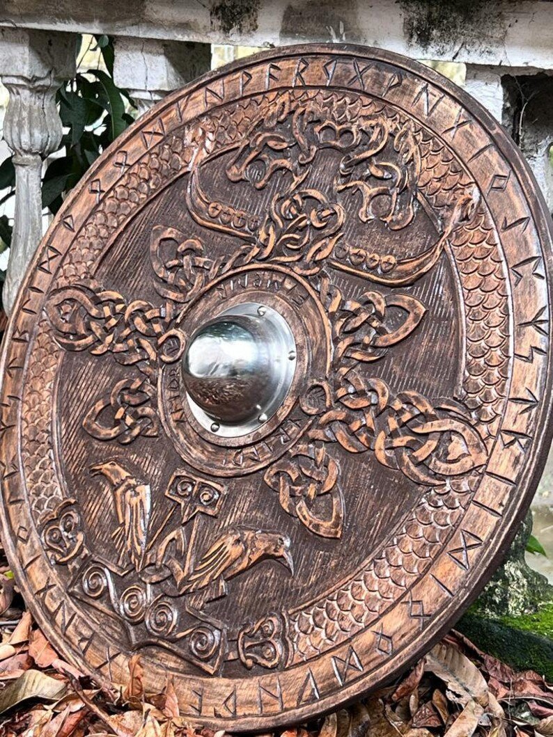 Front view of the hand-carved wooden Viking Round Dragon Shield, showcasing intricate Norse-inspired designs.