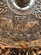 Viking Round Dragon Shield mounted on a wall, demonstrating its suitability as home decor