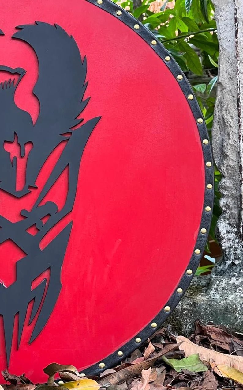 Authentic Viking wooden shield with a battle-worn finish, perfect for historical reenactments.