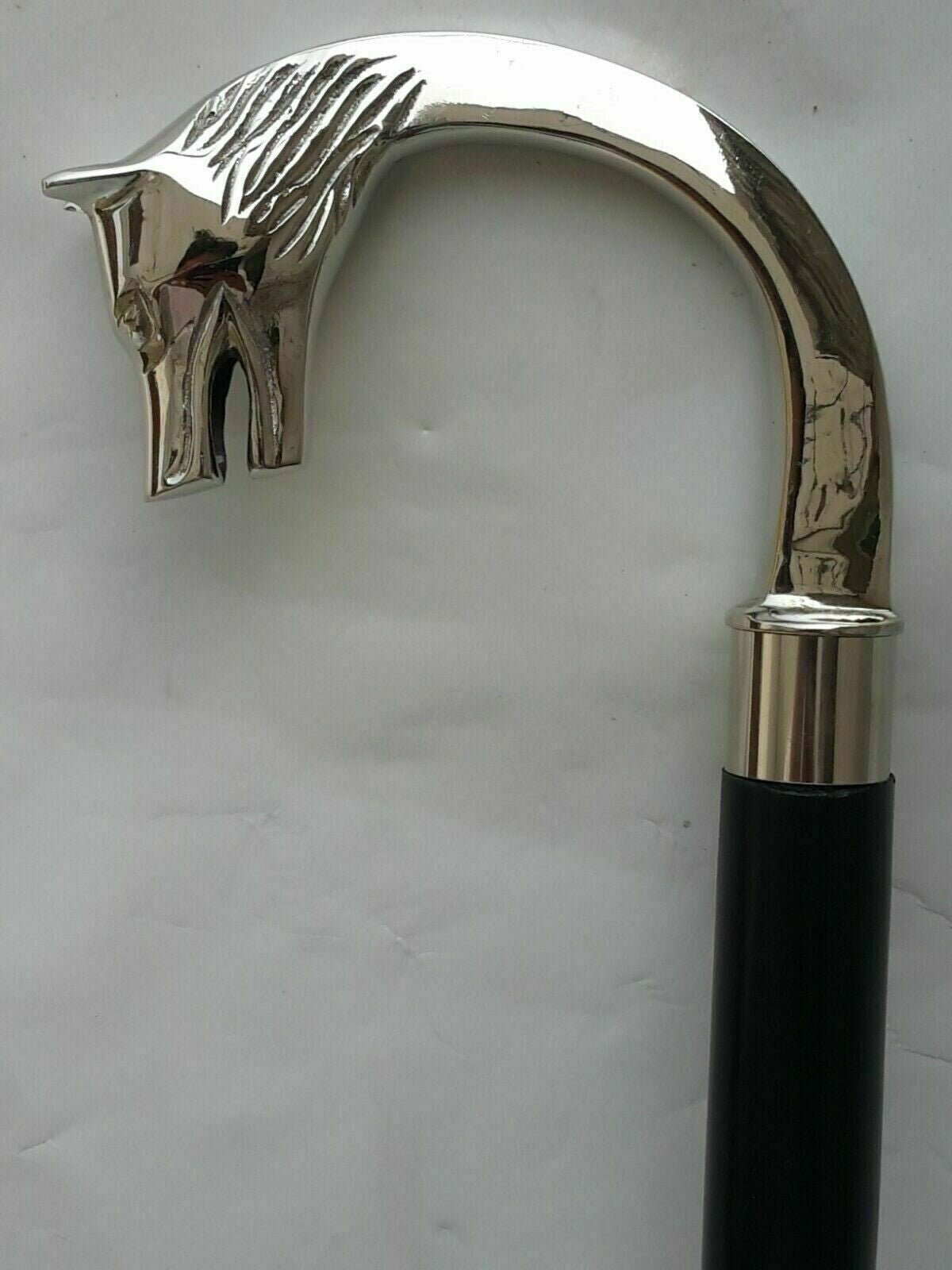 Elegant vintage walking stick with a nickel silver wolf head brass handle and solid wooden shaft, perfect as a gentleman's accessory.