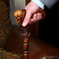 36'' wooden walking stick with a skull handle, combining durability, comfort, and traditional craftsmanship.