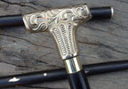 Wooden walking stick with brass handle in nautical vintage style, showcasing classic craftsmanship.