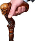 Handmade 36'' wooden walking stick with intricately carved skull-shaped handle.