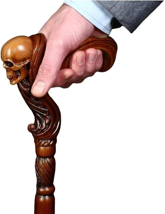 Handmade 36'' wooden walking stick with intricately carved skull-shaped handle.