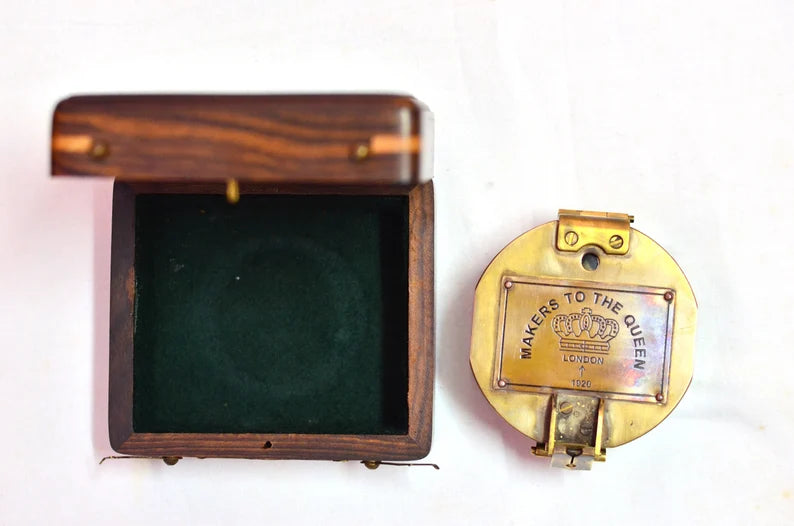 Portable brass Brunton compass with wooden case for navigation, an excellent gift for collectors and surveyors.